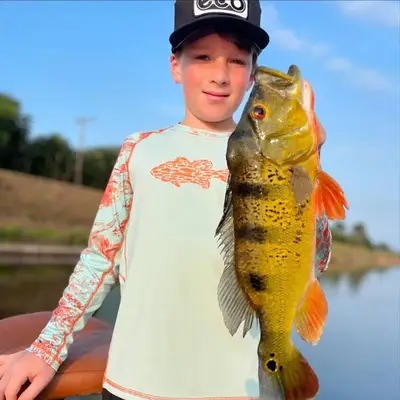 Kid with Peacock Bass